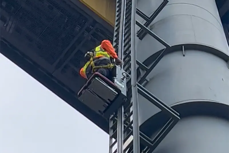The 3S LIFT tower climber is applied to an outdoor billboard at the University of Los Angeles Stadium